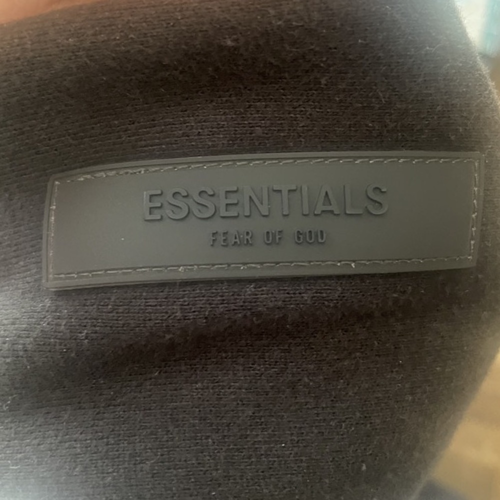 Black fear of god essentials hoodie